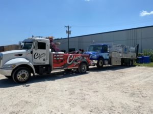 Chavez Towing Service Towing Blue Truck