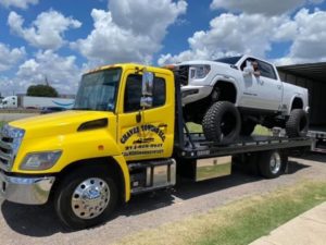 Flatbed Towing Service Towing White Hilux Truck