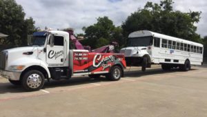 White Truck Towing White School Bus