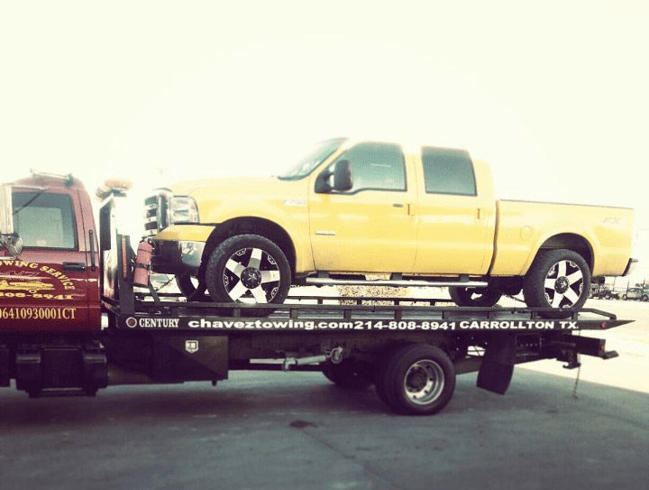 Towing Truck Loaded with Yellow Truck
